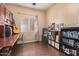 Home office with built-in shelves and a work desk at 15839 W Calavar Rd, Surprise, AZ 85379