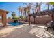 Inviting swimming pool with pergola and water feature at 15839 W Calavar Rd, Surprise, AZ 85379