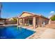 Sparkling pool with patio and house view at 15839 W Calavar Rd, Surprise, AZ 85379