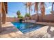 Relaxing pool area with water feature and pergola at 15839 W Calavar Rd, Surprise, AZ 85379