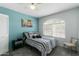 Cozy bedroom featuring ample natural light, closet and a soothing blue accent wall at 16241 S 40Th Way, Phoenix, AZ 85048