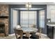 Cozy dining nook with a bay window, modern light fixture, and a circular table with elegant chairs at 16241 S 40Th Way, Phoenix, AZ 85048