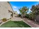 Landscaped backyard with patio and artificial turf at 1631 N Beverly --, Mesa, AZ 85201