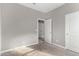 Light-filled bedroom with carpet and doors to hallway at 1631 N Beverly --, Mesa, AZ 85201