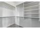 Walk-in closet with double hanging rods and shelves at 1631 N Beverly --, Mesa, AZ 85201