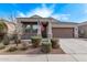 Single-story home with two-car garage and landscaped yard at 1631 N Beverly --, Mesa, AZ 85201