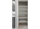 White pantry with pull-out shelves offering ample storage space at 1631 N Beverly --, Mesa, AZ 85201