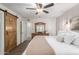 Spacious bedroom with wood flooring and a barn door at 16420 N Scorpion Dr, Fountain Hills, AZ 85268