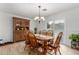 Bright dining room with a wood table, chairs, and a built-in hutch at 16420 N Scorpion Dr, Fountain Hills, AZ 85268