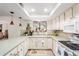 Galley kitchen with light cabinets and view to dining area at 16420 N Scorpion Dr, Fountain Hills, AZ 85268