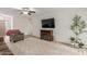 Living room with brown couch, electric fireplace, and patterned rug at 16420 N Scorpion Dr, Fountain Hills, AZ 85268