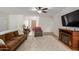 Living room with brown couch, electric fireplace, and patterned rug at 16420 N Scorpion Dr, Fountain Hills, AZ 85268