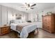 Main bedroom with a king-size bed, ceiling fan, and wood accents at 16420 N Scorpion Dr, Fountain Hills, AZ 85268