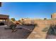 Landscaped backyard with stone pathway and cacti at 17584 W Andora St, Surprise, AZ 85388