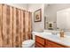 Guest bathroom with single vanity and shower at 17584 W Andora St, Surprise, AZ 85388