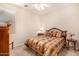 Cozy bedroom with a double bed, window seating, and neutral color palette at 17584 W Andora St, Surprise, AZ 85388