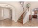 Two-story entryway with a staircase and tile floors at 17584 W Andora St, Surprise, AZ 85388