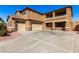 Two-story house with a three-car garage and a large driveway at 17584 W Andora St, Surprise, AZ 85388