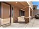 Front entrance with a tan door and stone accents at 17584 W Andora St, Surprise, AZ 85388