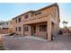 Two-story house with covered patio and desert landscaping at 17584 W Andora St, Surprise, AZ 85388