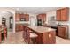 Spacious kitchen with center island and dark wood cabinets at 17584 W Andora St, Surprise, AZ 85388