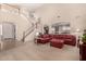 Living room with a sectional sofa, a large window, and a view of the kitchen at 17584 W Andora St, Surprise, AZ 85388