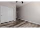 Bedroom with double doors and wood-look floors at 17962 W Vogel Ave, Waddell, AZ 85355