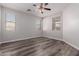 Primary bedroom with ceiling fan and lots of natural light at 17962 W Vogel Ave, Waddell, AZ 85355