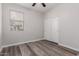 Bright bedroom with wood-look floors and double door closet at 17962 W Vogel Ave, Waddell, AZ 85355