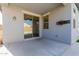 Covered patio with sliding glass doors leading to the backyard at 17962 W Vogel Ave, Waddell, AZ 85355