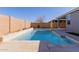 Relaxing pool area with a spa and ample patio space at 17962 W Vogel Ave, Waddell, AZ 85355