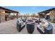 Expansive backyard with firepit, pool, and multiple seating areas at 18212 W East Wind Ave, Goodyear, AZ 85338