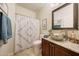 Bathroom with shower, pedestal sink, and granite countertop at 18212 W East Wind Ave, Goodyear, AZ 85338