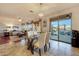 Bright dining area with glass table and chairs, adjacent to kitchen at 18212 W East Wind Ave, Goodyear, AZ 85338