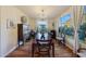 Bright dining room with hardwood floors, chandelier, and large windows at 18212 W East Wind Ave, Goodyear, AZ 85338