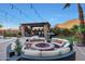 Outdoor seating area with firepit and pergola at 18212 W East Wind Ave, Goodyear, AZ 85338