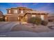 Two-story house with a large driveway and landscaping at 18212 W East Wind Ave, Goodyear, AZ 85338