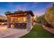 Covered outdoor bar with seating and stone accents at 18212 W East Wind Ave, Goodyear, AZ 85338