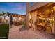 Covered patio with bar and seating area, overlooking the pool at 18212 W East Wind Ave, Goodyear, AZ 85338