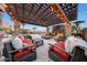 Relaxing outdoor space with covered seating and firepit at 18212 W East Wind Ave, Goodyear, AZ 85338