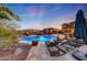 Inviting pool area with lounge chairs and patio at 18212 W East Wind Ave, Goodyear, AZ 85338