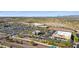 Aerial view of shopping center with ample parking and various stores at 18212 W East Wind Ave, Goodyear, AZ 85338