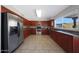 Modern kitchen featuring wood cabinets and granite countertops at 18239 N 46Th St, Phoenix, AZ 85032