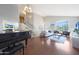 Bright living room featuring hardwood floors, high ceilings, and a grand piano at 18239 N 46Th St, Phoenix, AZ 85032