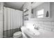 Stylish bathroom with a modern sink, vanity, subway tiles, and shower at 1865 W 3Rd Pl, Mesa, AZ 85201