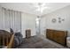 Bedroom with a glider, crib, dresser, and bright natural light at 1865 W 3Rd Pl, Mesa, AZ 85201