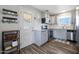 Well-lit kitchen featuring stainless steel appliances and modern cabinetry at 1865 W 3Rd Pl, Mesa, AZ 85201