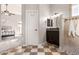 Spa-like bathroom with shower and checkerboard floor at 1875 E Stephens Dr, Tempe, AZ 85283