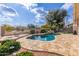 Inviting kidney-shaped pool with stone decking at 1875 E Stephens Dr, Tempe, AZ 85283