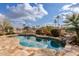 Inviting kidney-shaped pool with large patio and lake views at 1875 E Stephens Dr, Tempe, AZ 85283